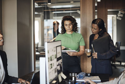 Female business colleagues planning strategy at office