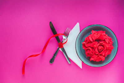 High angle view of pink roses on table