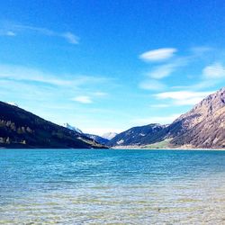 Scenic view of lake against blue sky