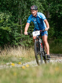 Full length of a man riding bicycle