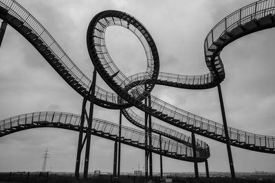 Low angle view of ferris wheel against sky