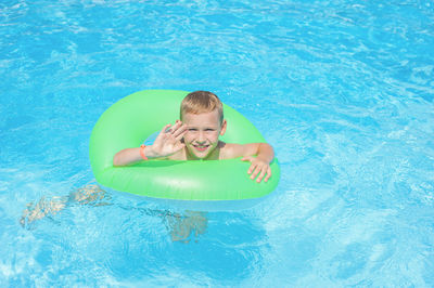 Portrait of smiling girl in swimming pool