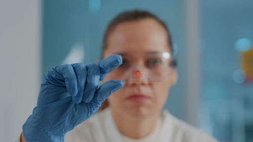 Portrait of doctor showing blood sample