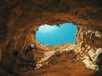 Cave on the sea with blue sky down in algarve, portugal