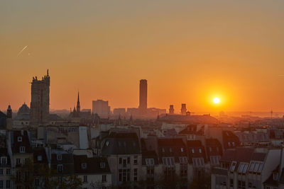 High angle view of buildings against sky during sunset