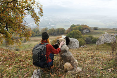 Rear view of friends looking away on mountain