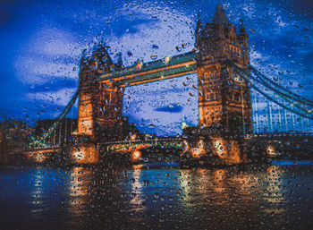 Reflection of buildings in city at night
