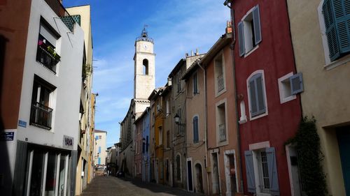 Narrow street amidst buildings in town