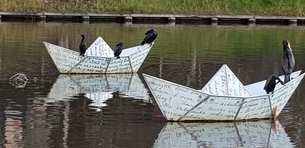 Close-up of ship moored in lake