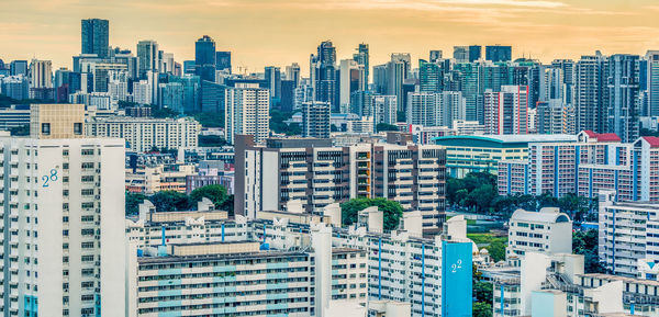 Aerial view of modern buildings in city against sky