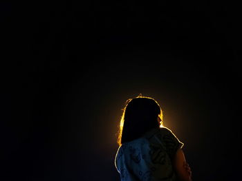 Man standing against sky at night