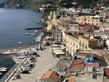 High angle view of townscape by sea