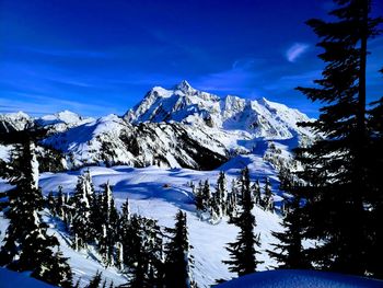 Scenic view of snowcapped mountains against sky