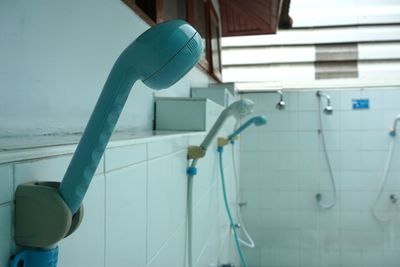 Close-up of faucet in bathroom