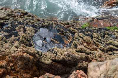 High angle view of rocks in sea