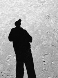 Shadow of man standing on ground