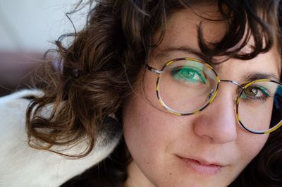 Close-up portrait of woman wearing eyeglasses