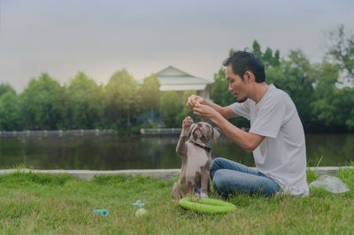 Woman with dog on field