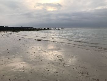 Scenic view of beach against sky