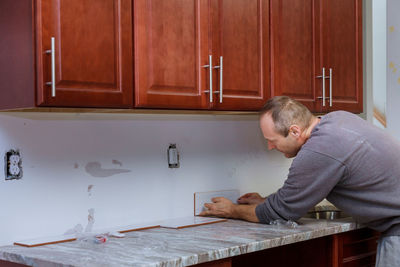 Man working on table at home