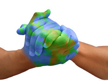 Close-up of hand holding multi colored background