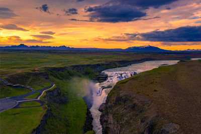 Scenic view of landscape against sky during sunset