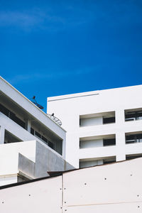 Low angle view of building against blue sky