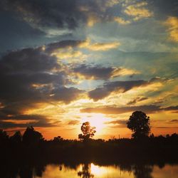 Scenic view of lake at sunset