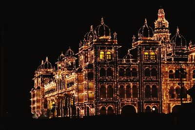 Low angle view of illuminated building at night