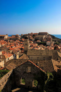 High angle view of townscape against blue sky