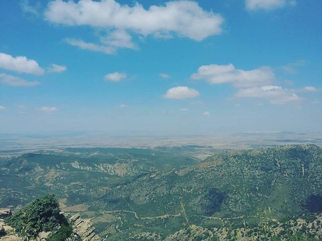 tranquil scene, tranquility, scenics, landscape, beauty in nature, sky, nature, mountain, blue, idyllic, cloud - sky, cloud, horizon over land, non-urban scene, high angle view, remote, day, outdoors, mountain range, no people