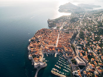 High angle view of buildings by sea