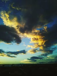 Low angle view of dramatic sky during sunset