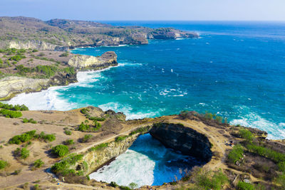 High angle view of sea shore against sky