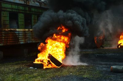 View of burning tires on field
