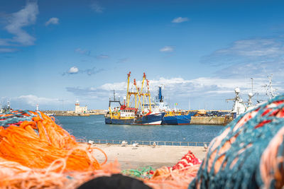 Boats in sea against sky