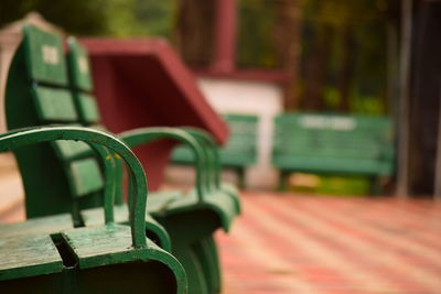 Close-up of empty bench in park