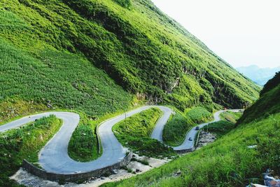 High angle view of road by green mountain