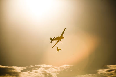 Low angle view of airplane in sky