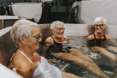 Happy female friends in spa