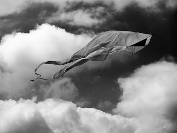 Low angle view of flag against cloudy sky