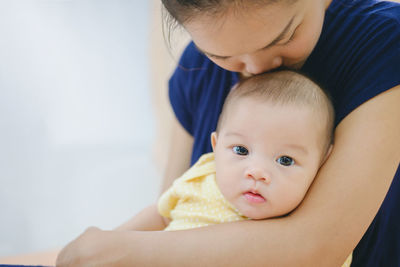 Close-up of mother with baby boy