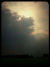 Scenic view of landscape against cloudy sky