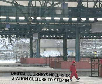 Man waiting at railroad station