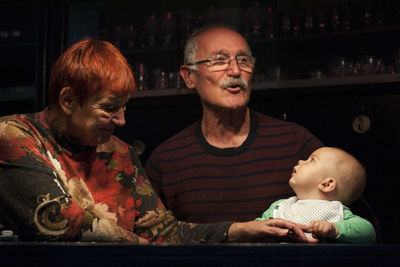 Portrait of grandparents with grandson