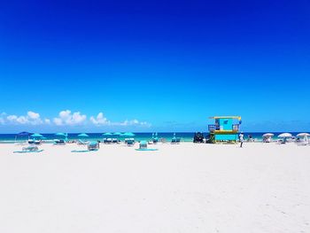 Panoramic view of beach against blue sky