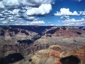 Scenic view of dramatic landscape against cloudy sky