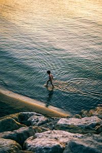 Child walking thru water