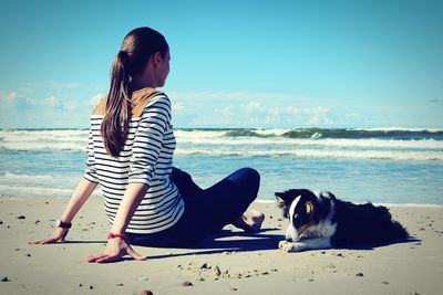 Side view of woman standing on beach