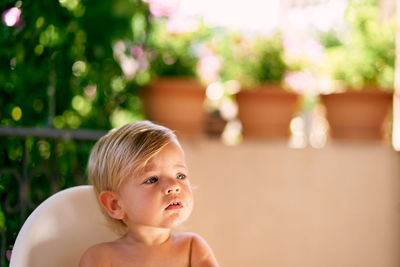 Portrait of cute boy looking away